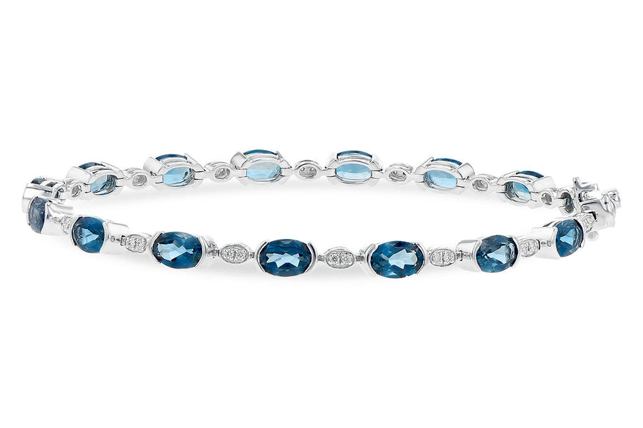 BRACELETS - 14K White Gold Oval London Blue Topaz And Diamond Tennis Bracelet