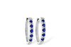 EARRINGS - 14K White Gold 1/4cttw Diamond And Sapphire Oval Huggie Earrings.