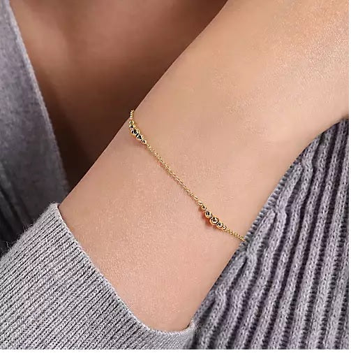 BRACELETS - 14K Yellow Gold Graduating Bead Stations 7 Inch Bracelet