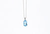 NECKLACES - 10K White Gold 7x5mm Oval Blue Topaz Necklace