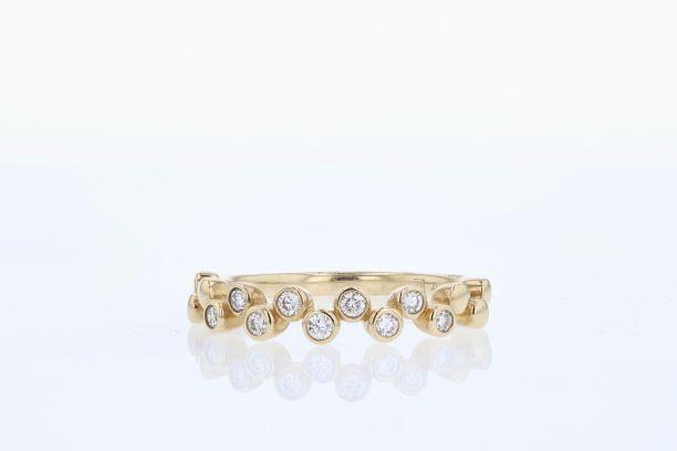 RINGS - 10K Yellow Gold 1/5cttw Bezel Diamond Band.
