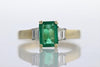 RINGS - 14K Yellow Gold 1.28cttw Emerald Cut Emerald & Diamond Baguette Accent Band.