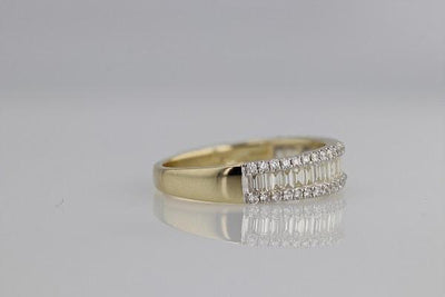RINGS - 14K Yellow Gold 3/4cttw Baguette And Round Diamond Band.