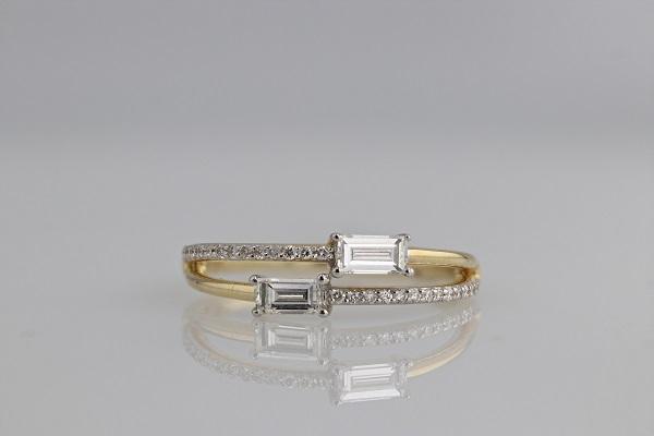 RINGS - 14K Yellow Gold .50cttw Round & Baguette Diamond Fashion Ring.